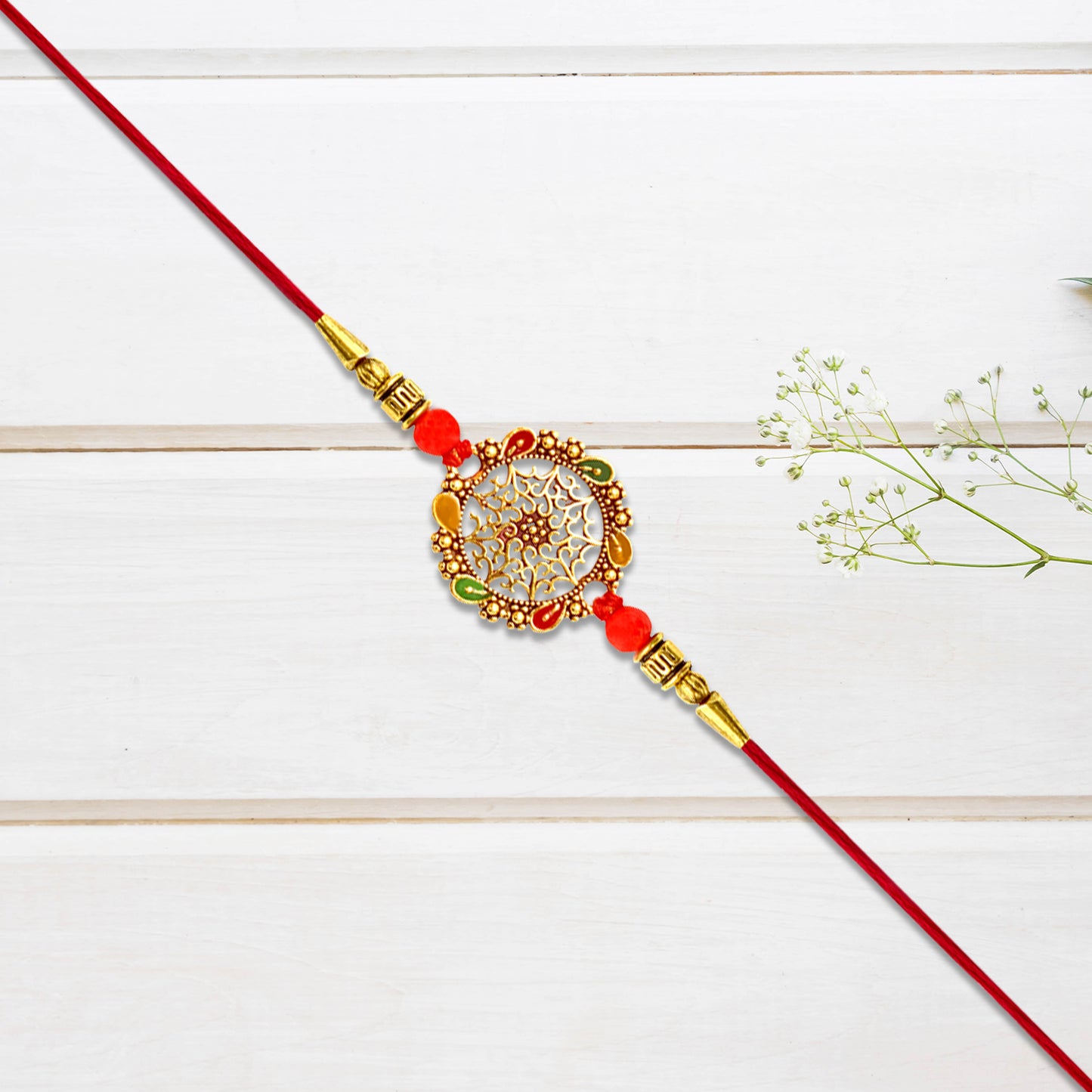 Intricately Designed Circular Rakhi With Multicolor Accents And Red Thread For Rakshabandhan - warehousetech13