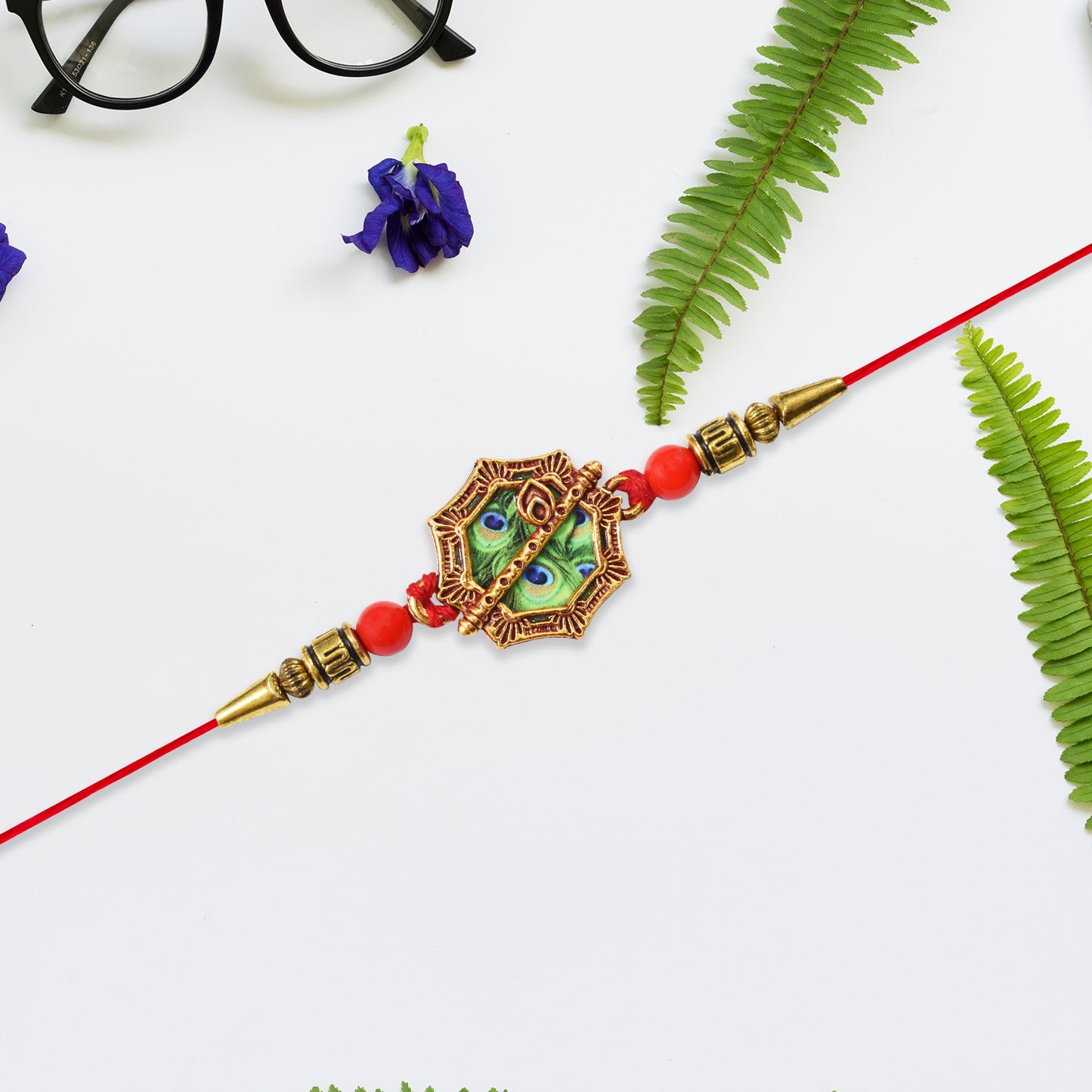 Silver Plated Floral Rakhi With Red Green Stones - warehousetech13