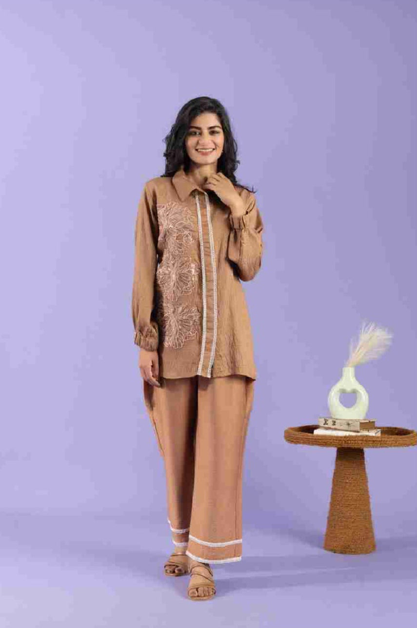 Woman in a brown traditional outfit with a purple background