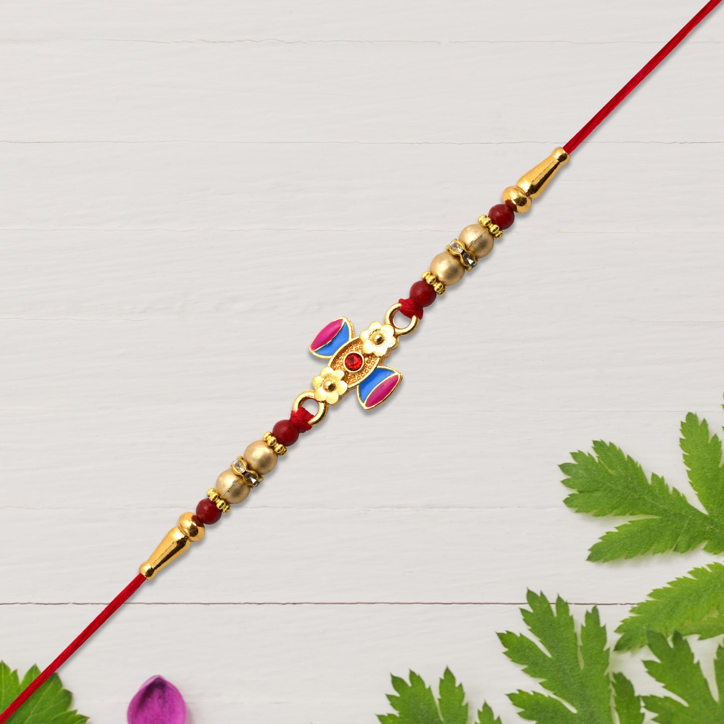 Damru Rakhi With Beads And Floral Detailing - warehousetech13