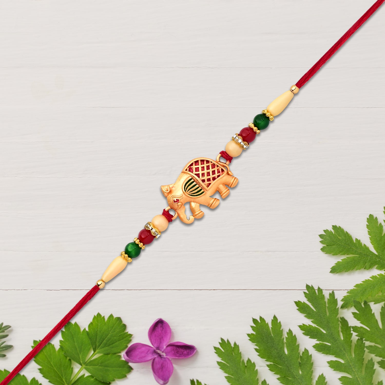 Golden Elephant Rakhi With Red Green Moti - warehousetech13