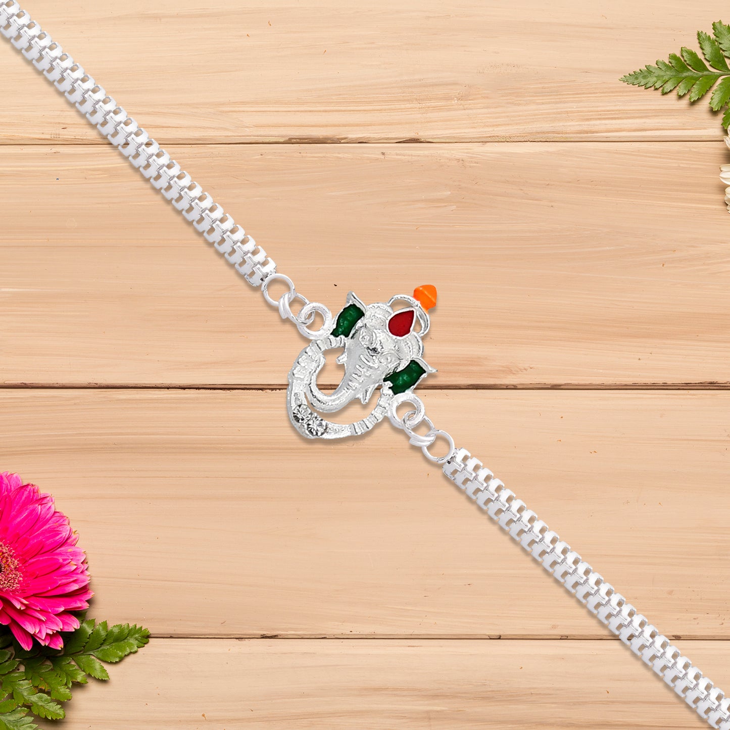 Stylish Ganesha Rakhi With Enamel Highlights And Silver Metal Chain - warehousetech13