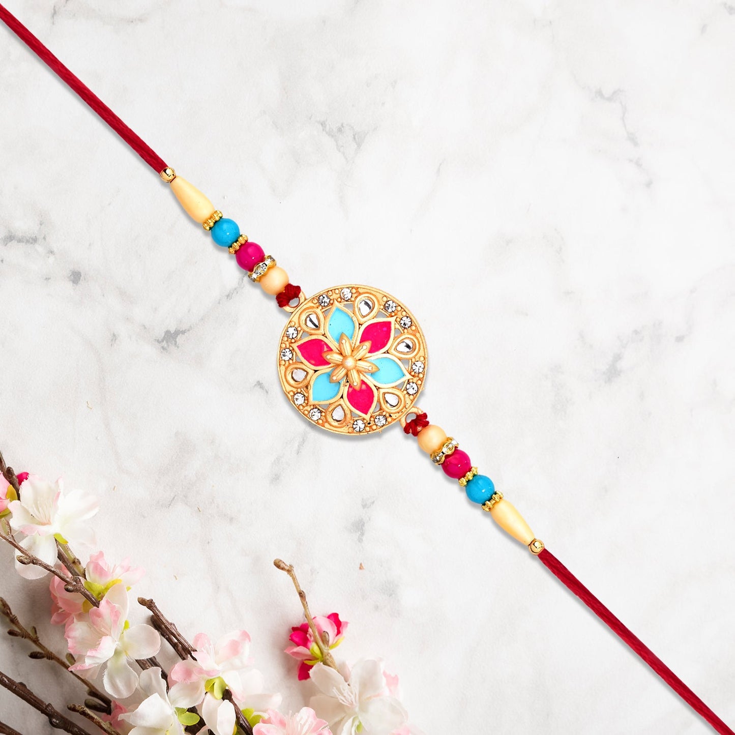 Round Floral Rakhi With Pink-blue Enamel And Beaded Thread - warehousetech13