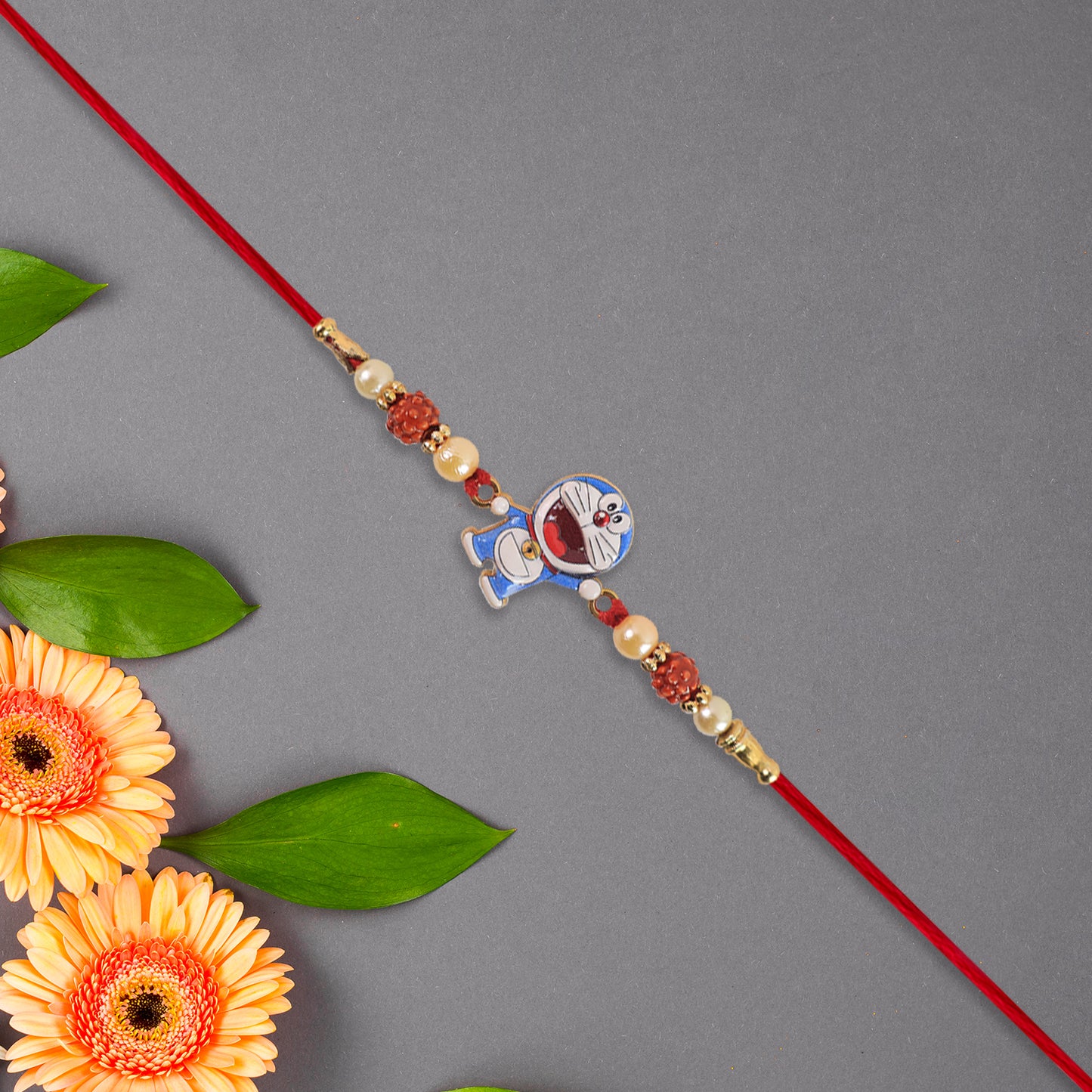 Cute Doraemon Kids Rakhi With Rudraksha Pearl Beads - warehousetech13