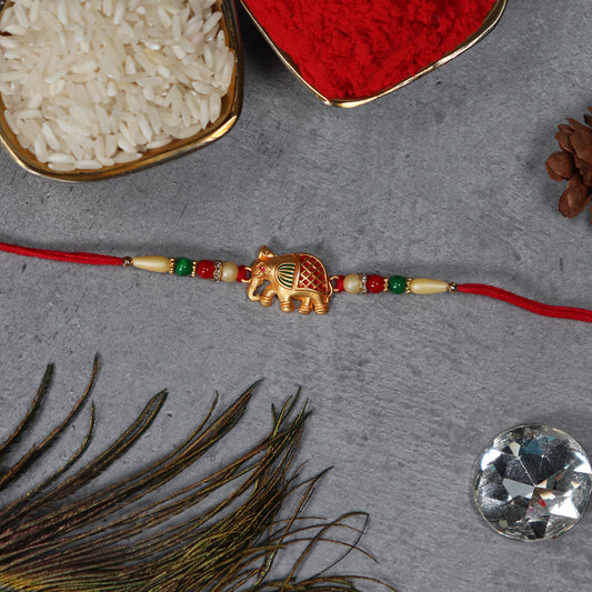 Golden Elephant Rakhi With Red Green Moti - warehousetech13