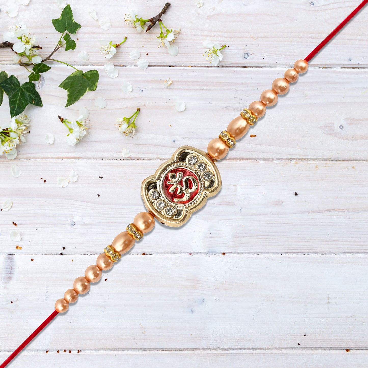 Om Rakhi With Stone Embellishments Golden Beads - warehousetech13