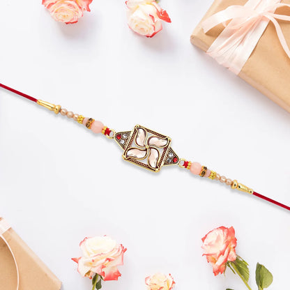Designer Rakhi With Swastik-inspired Kundan Dial And Decorative Beads - warehousetech13