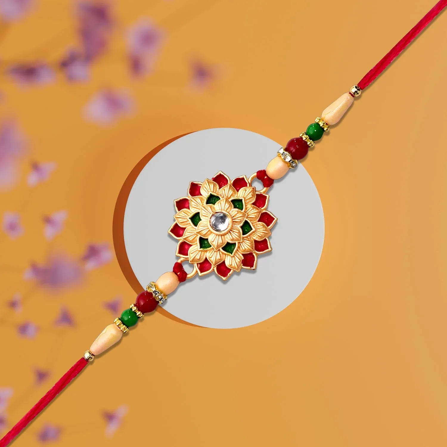 Designer Floral Rakhi With Beaded Strap Red Green Gold Accents - warehousetech13