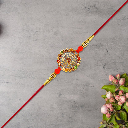Intricately Designed Circular Rakhi With Multicolor Accents And Red Thread For Rakshabandhan - warehousetech13