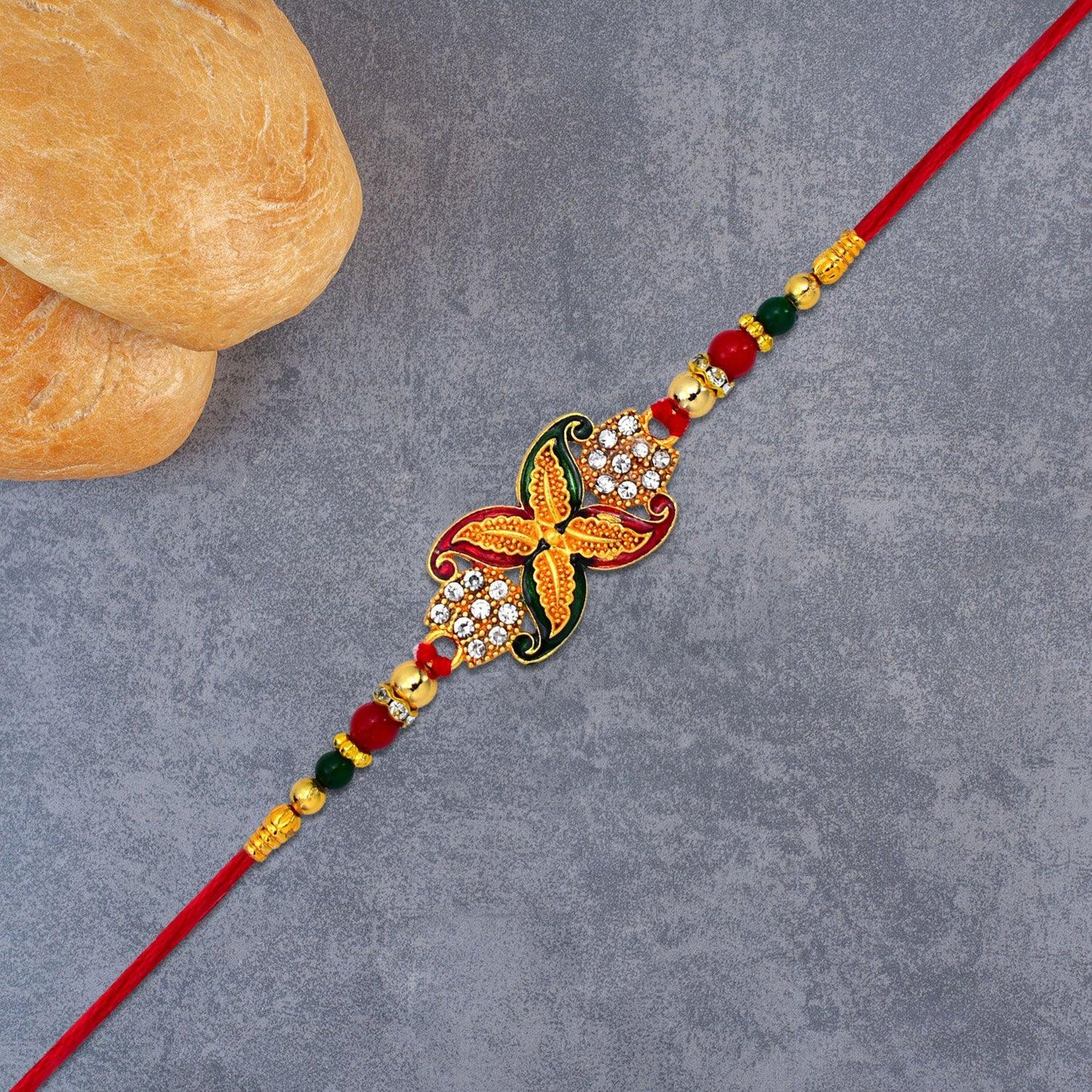 Elegant Red-green Bead Rakhi With Intricate Golden Flower Motif - warehousetech13