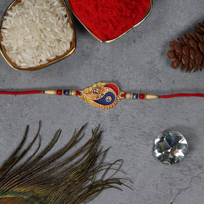 Elegant Rakhi With Enamel Paisley Design And Gold-tone Embellishments - warehousetech13