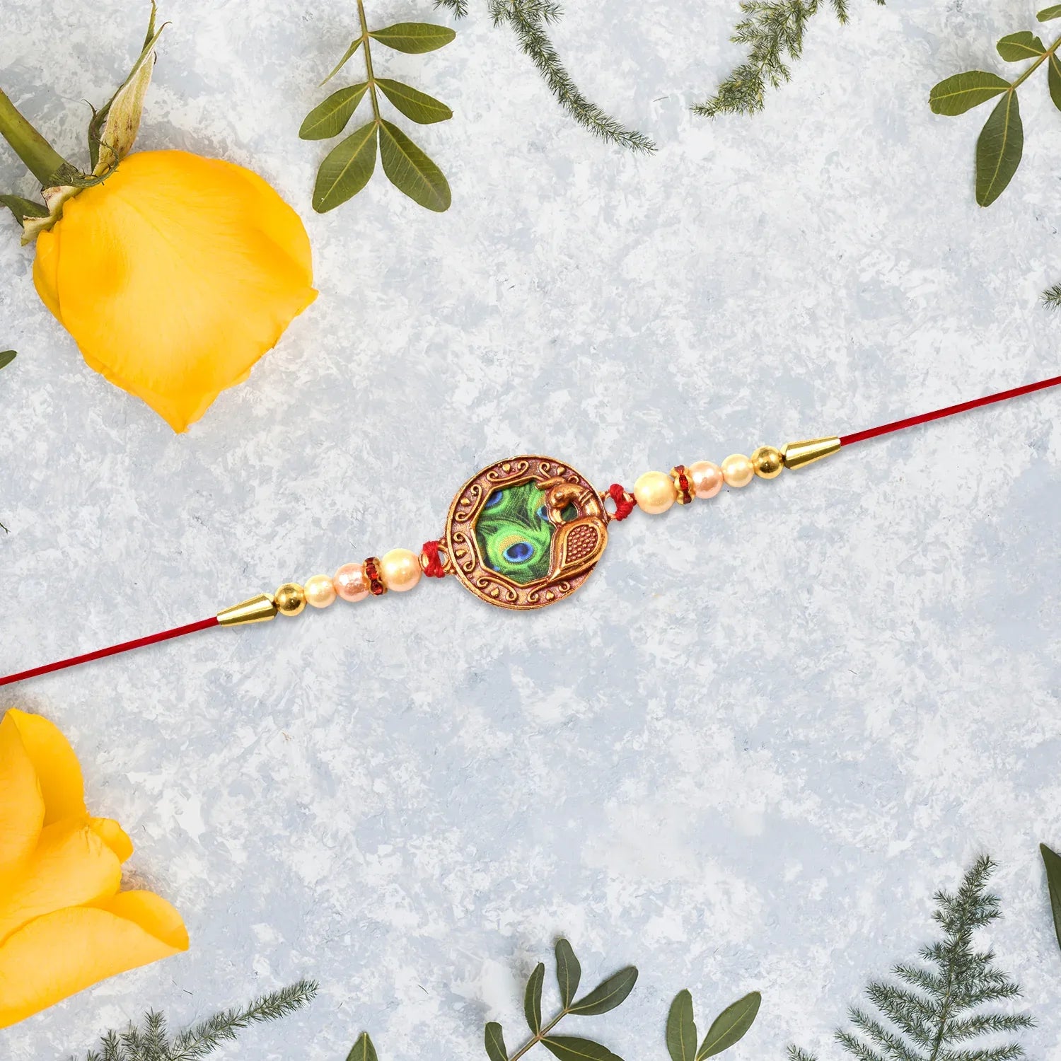 Elegant Rakhi With Peacock Feather Design And Pearl Bead Accents On Red Thread - warehousetech13
