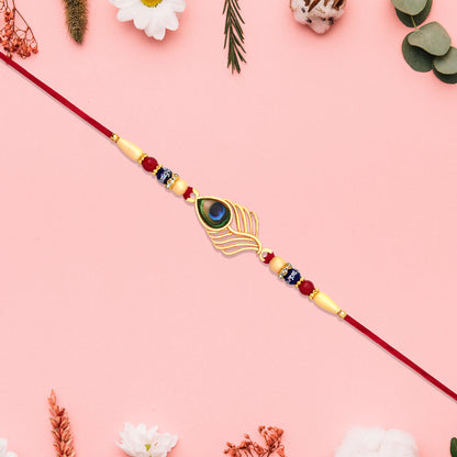 Peacock Feather Design Rakhi With Beaded Detailing And Red Thread - warehousetech13