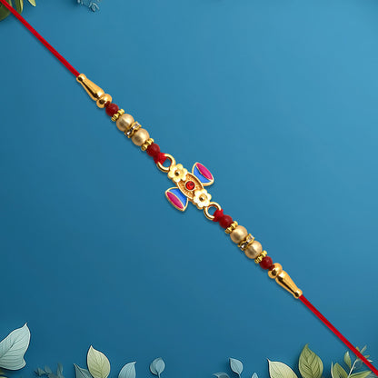 Damru Rakhi With Beads And Floral Detailing - warehousetech13